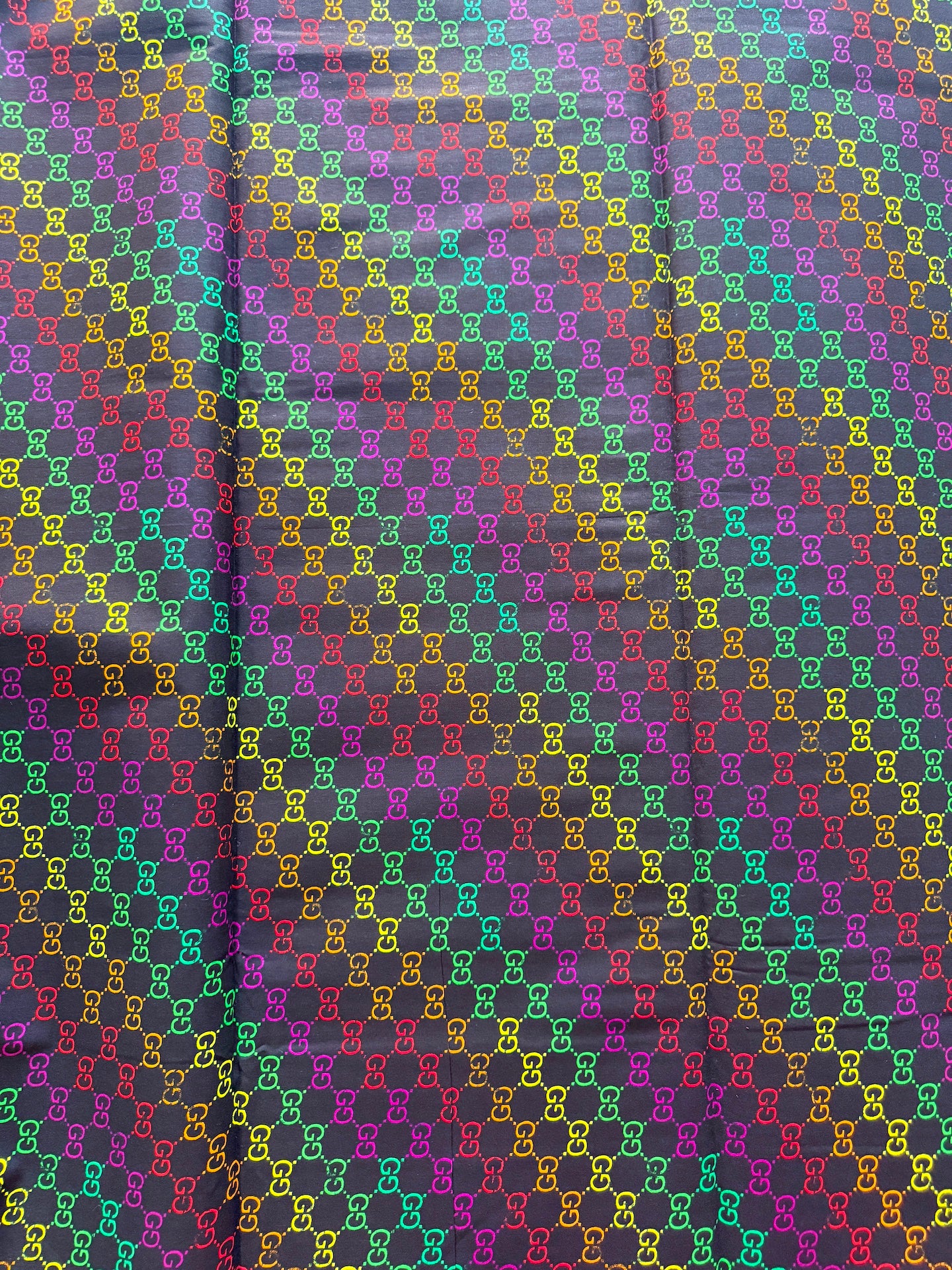 Multicolored patterned fabric with a checkered design.