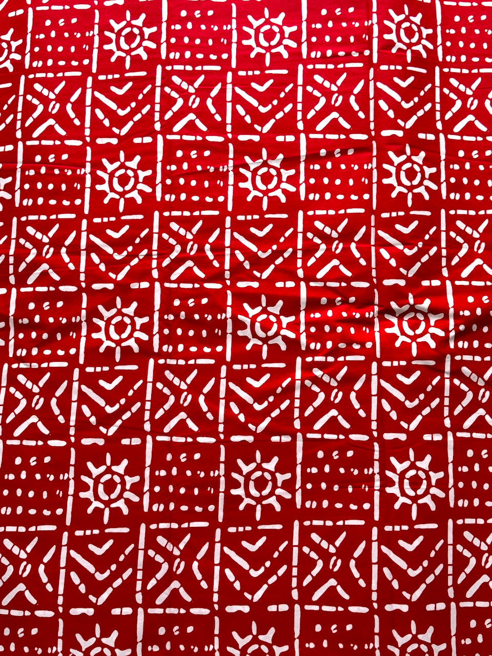 Red fabric with white geometric pattern