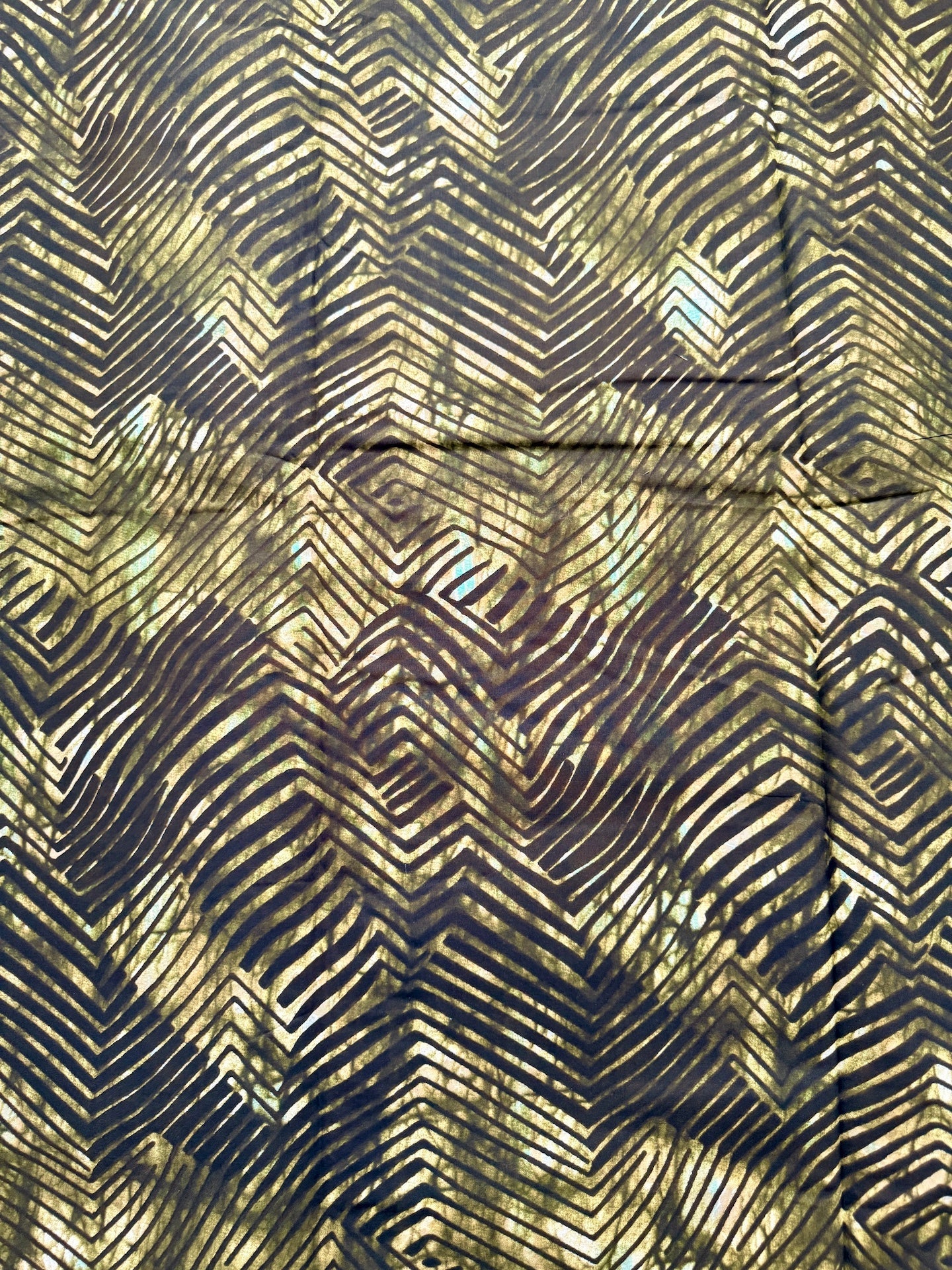 Textured fabric with abstract pattern in black and gold