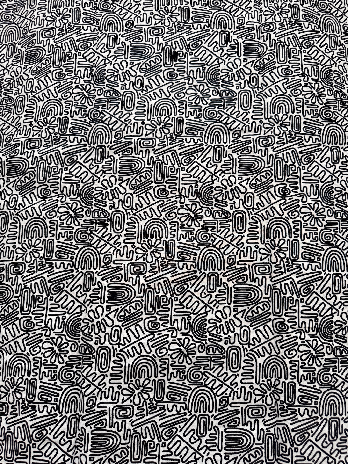 Black and white abstract pattern on a textured background
