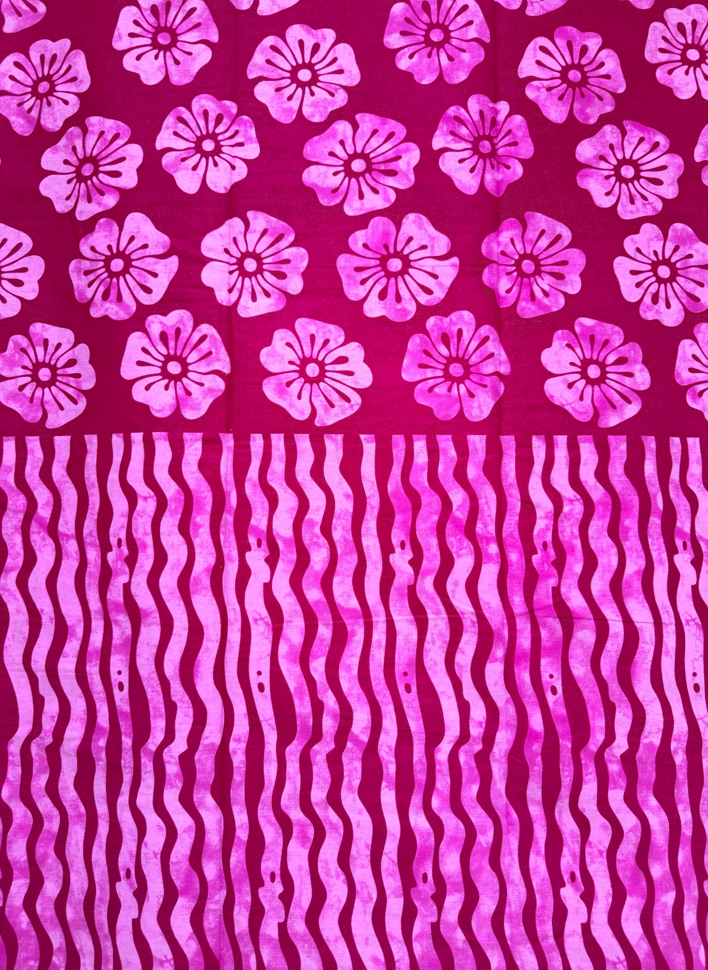 Fiberglass fabric with pink floral and wavy patterns on a red background