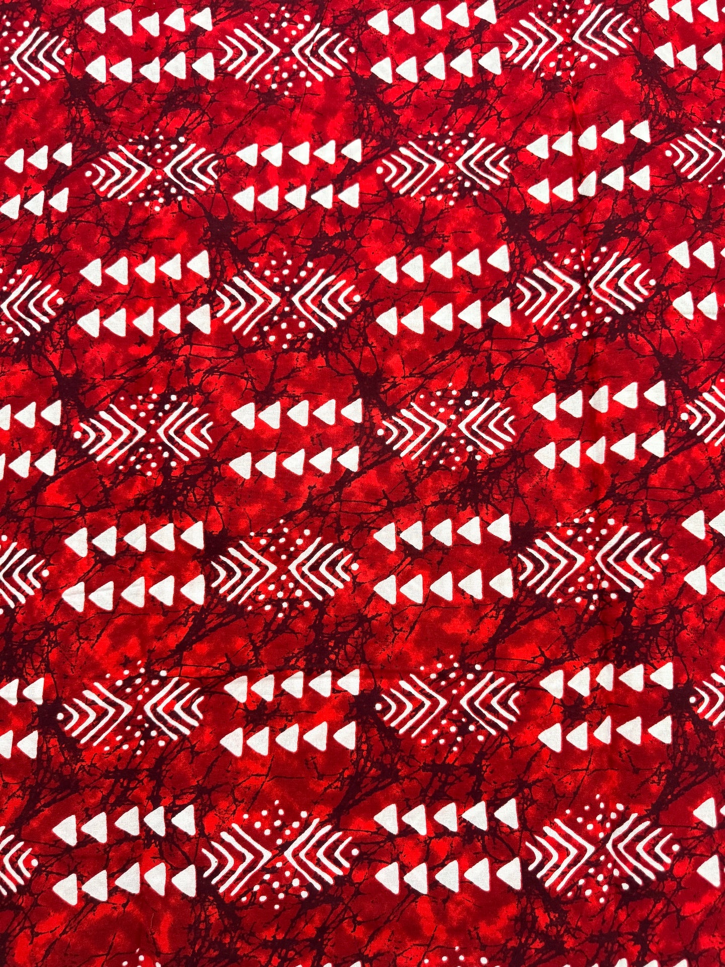 Red fabric with white geometric pattern
