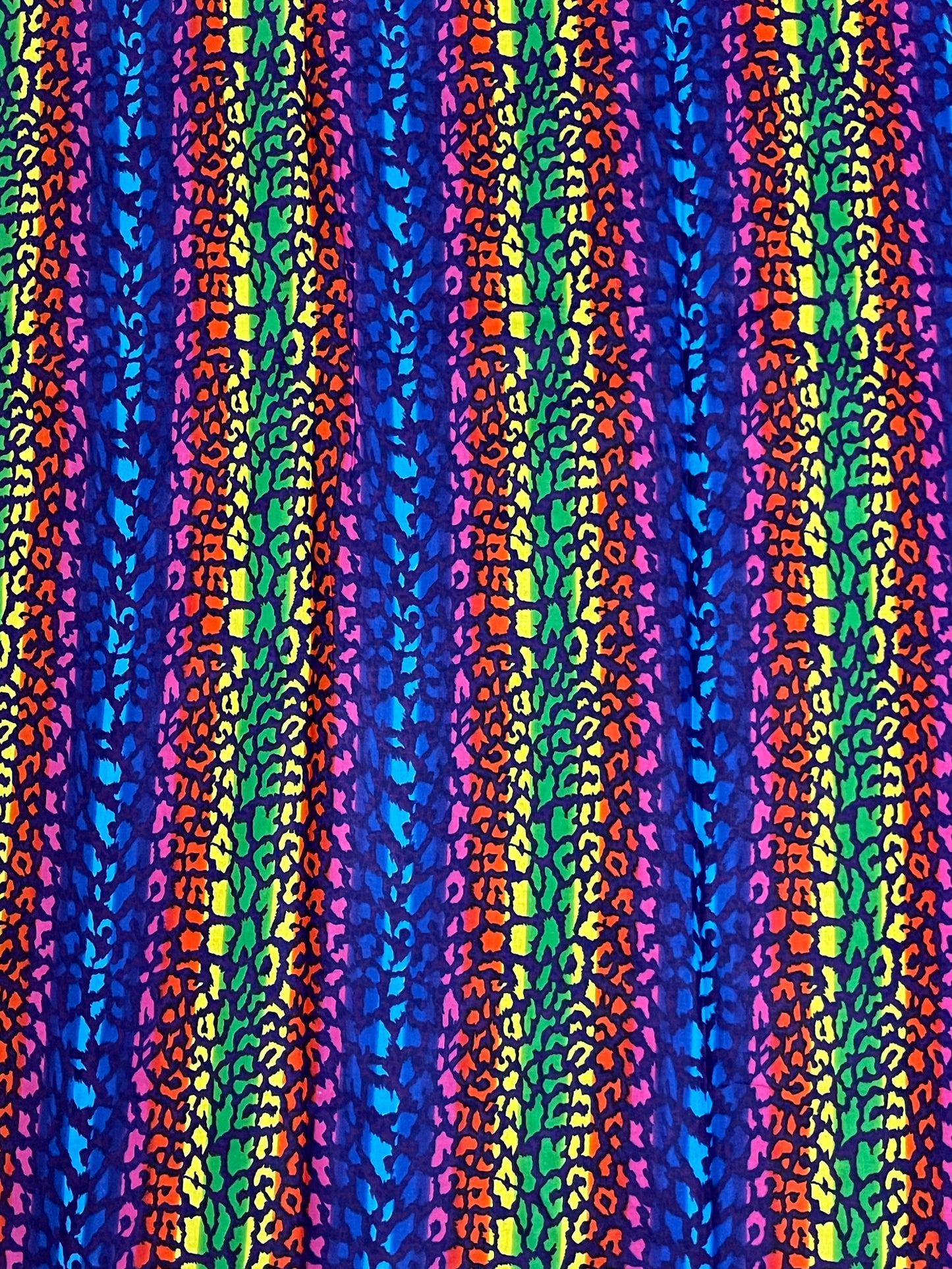 Colorful striped pattern with a leopard print texture