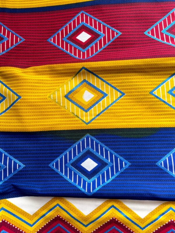 Close-up of colorful fabric with geometric patterns in red, yellow, and blue.