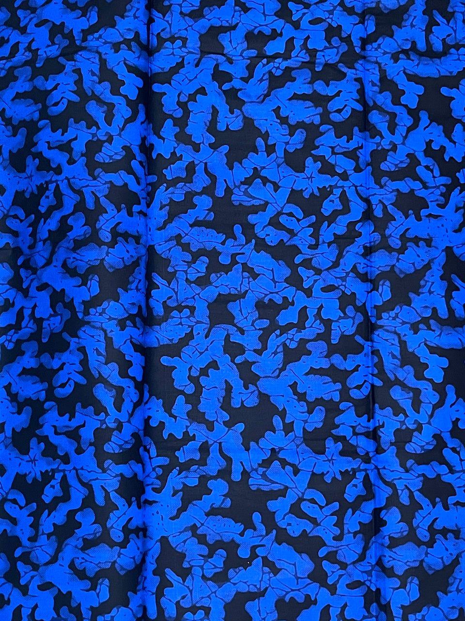 Blue coral pattern on black fabric