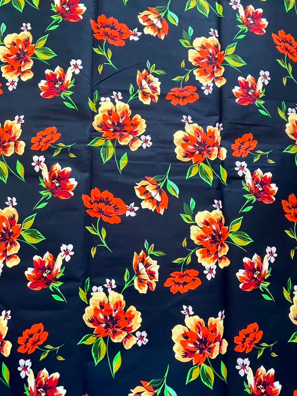 Navy blue fabric with colorful floral pattern