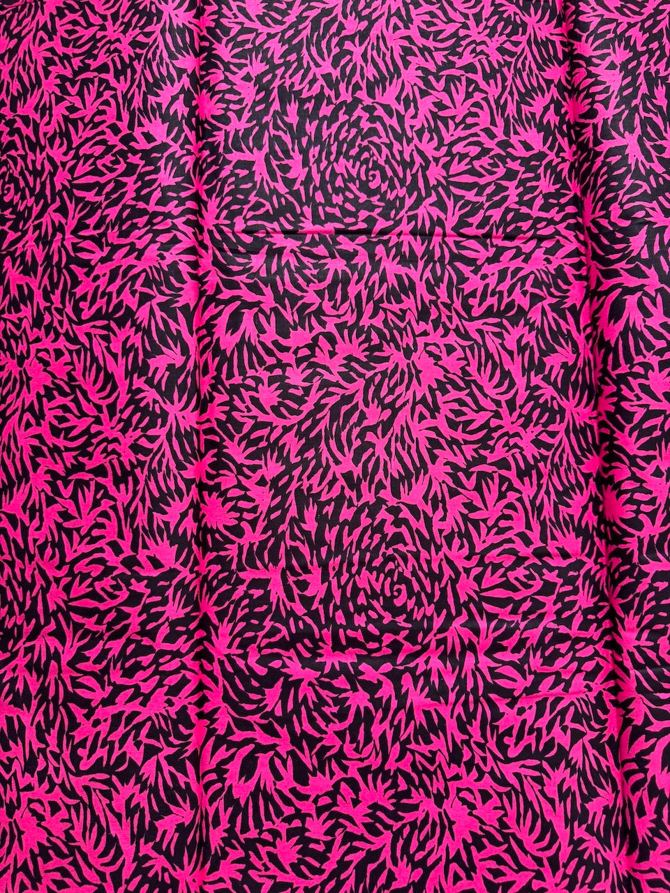 Pink and black abstract patterned fabric