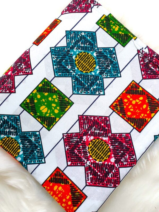 Colorful quilt with geometric patterns on a white background