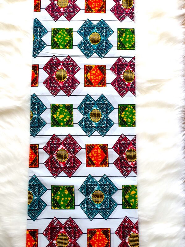 Colorful quilt pattern with geometric shapes on a white background