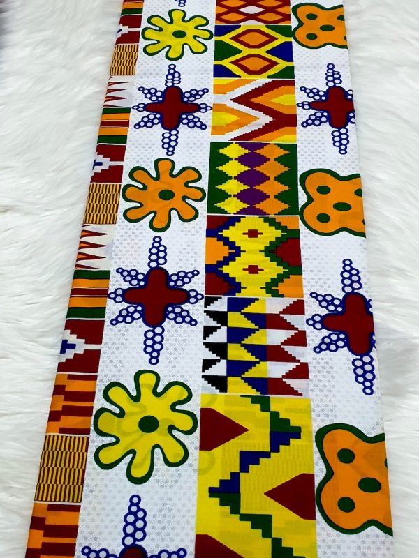 Colorful fabric strip with geometric patterns on a white background