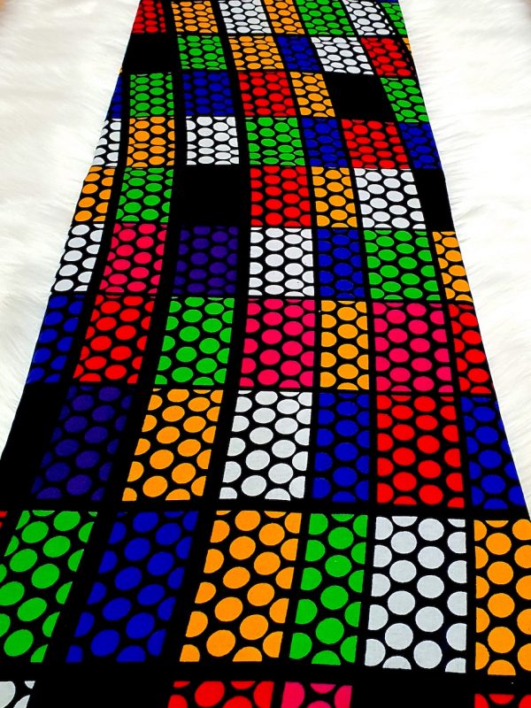 Colorful patterned fabric with geometric design on a white background