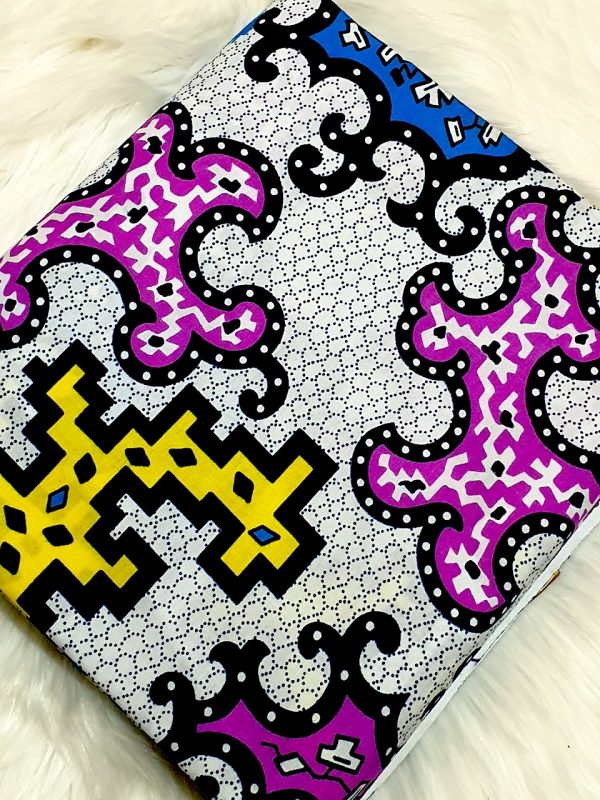 Colorful patterned fabric with geometric designs on a white background
