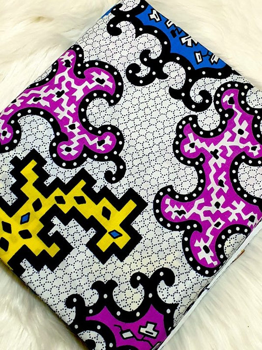Colorful patterned fabric with geometric designs on a white background