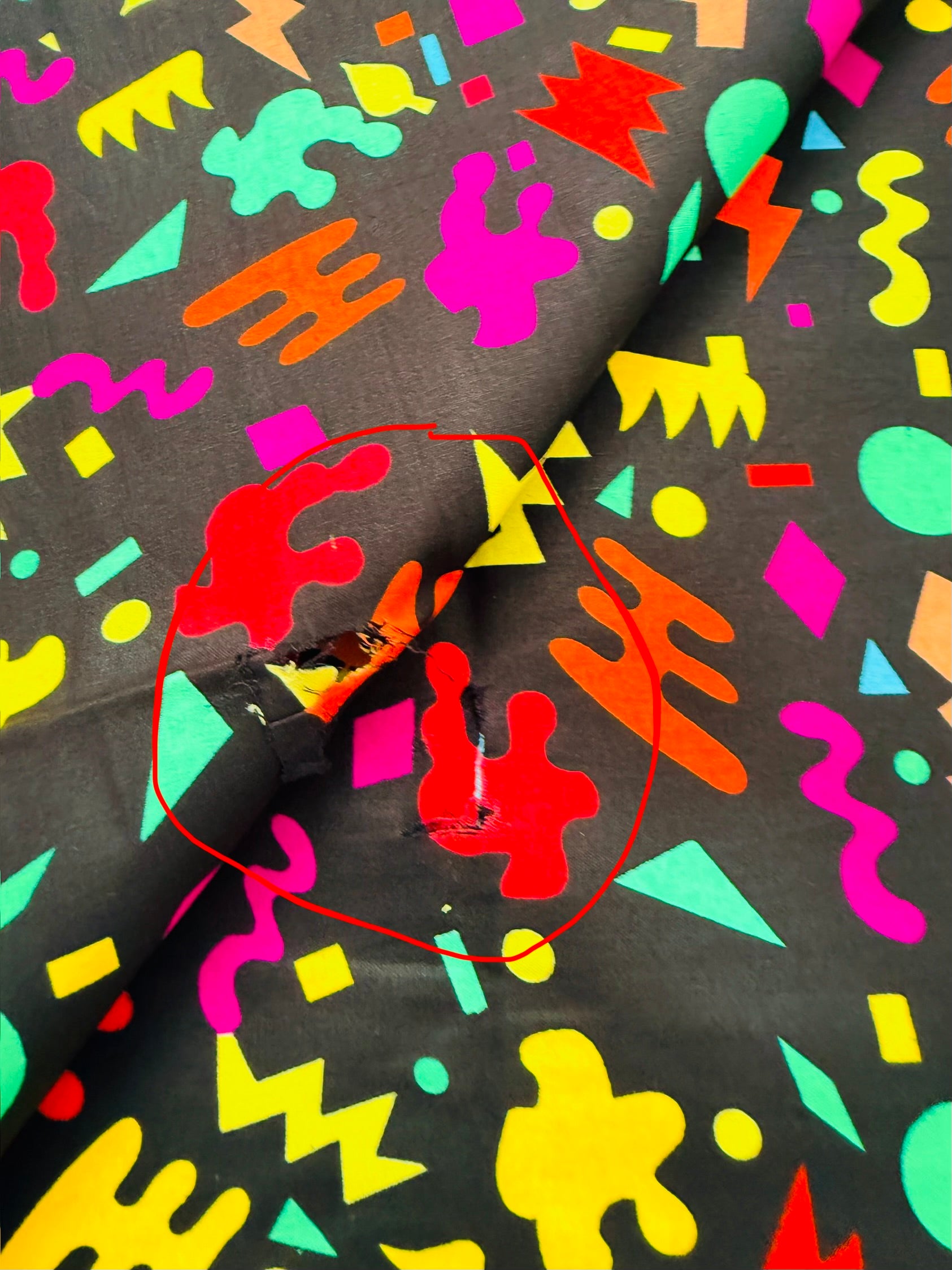 Colorful abstract pattern on fabric with a zipper