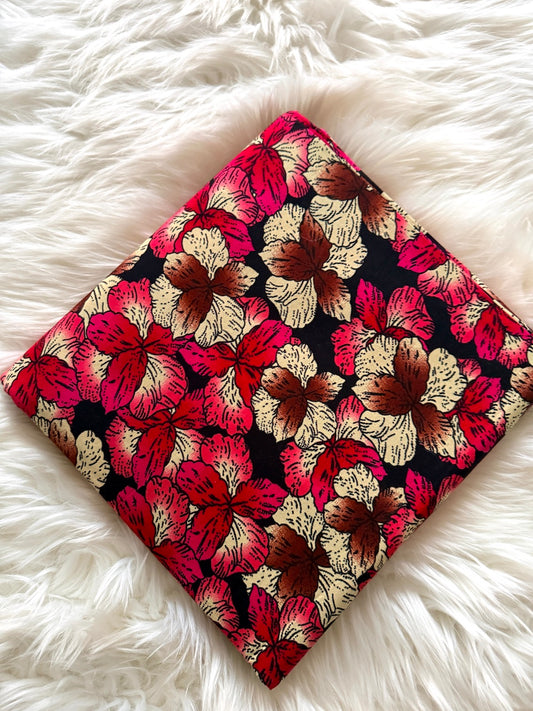 Floral patterned fabric on a fluffy white surface