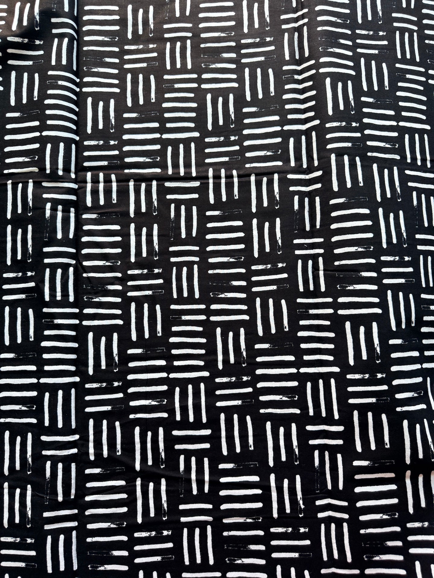 Black fabric with white geometric pattern