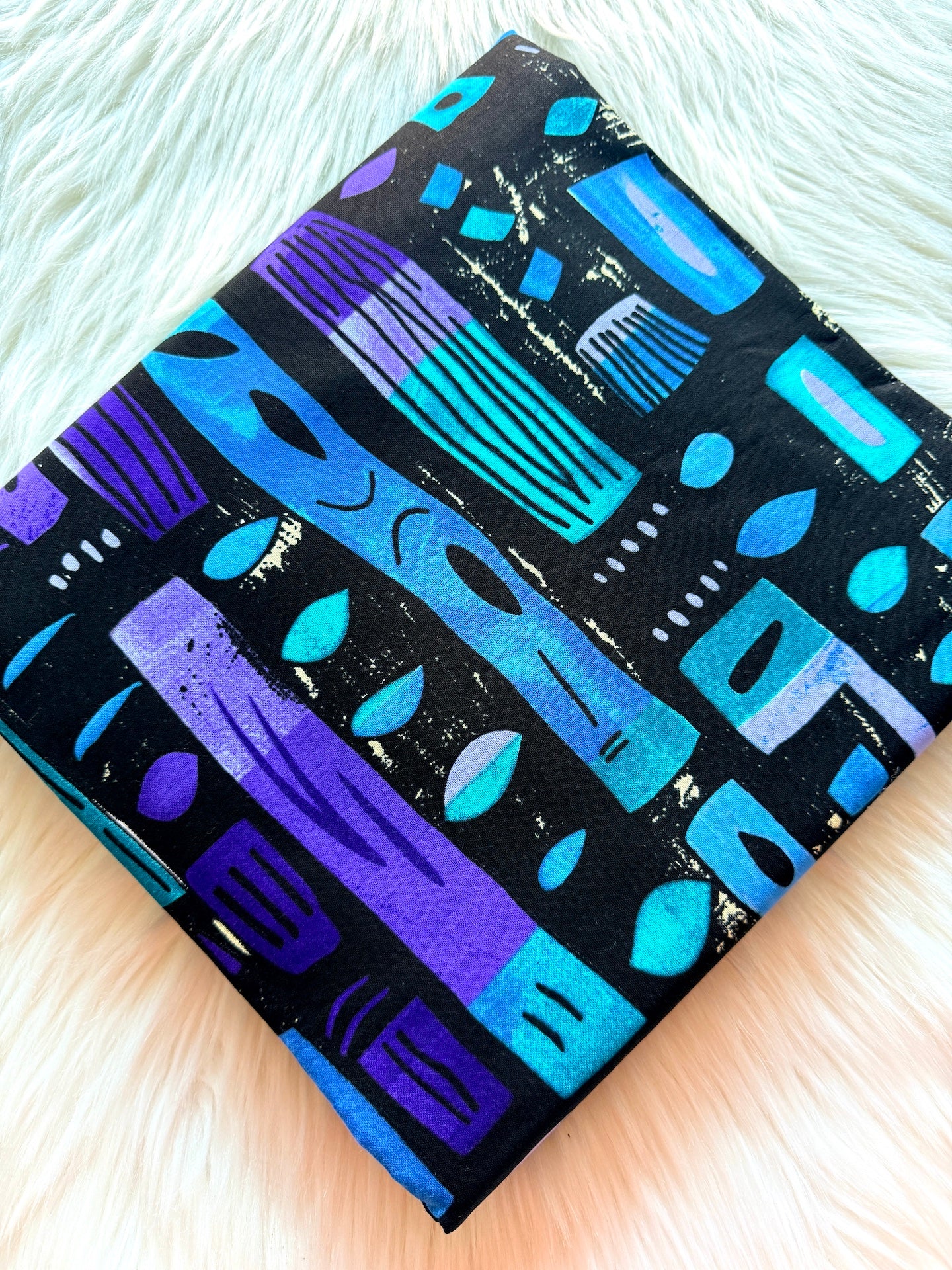 Colorful patterned box on a light wooden surface