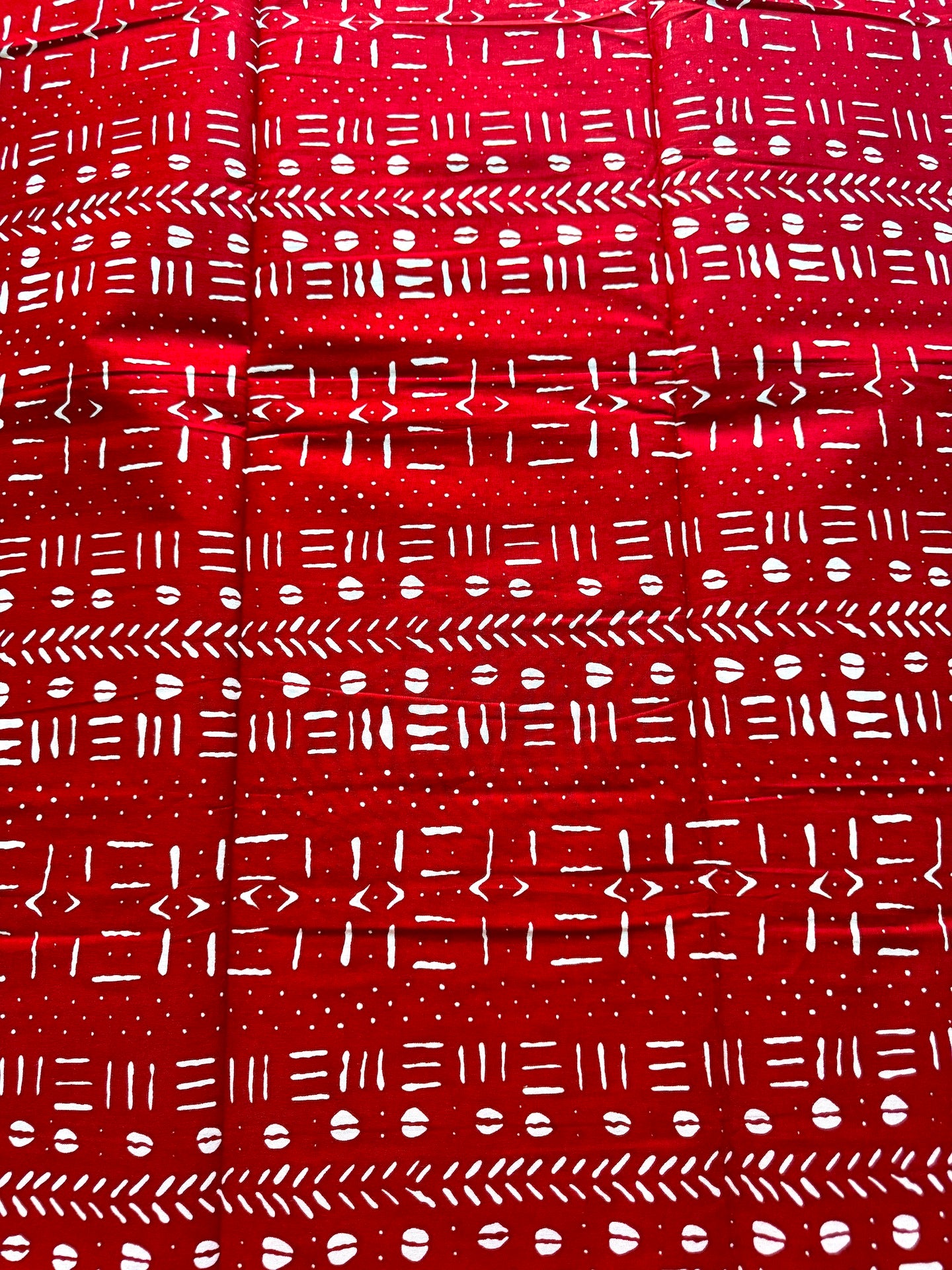 Red fabric with white geometric pattern