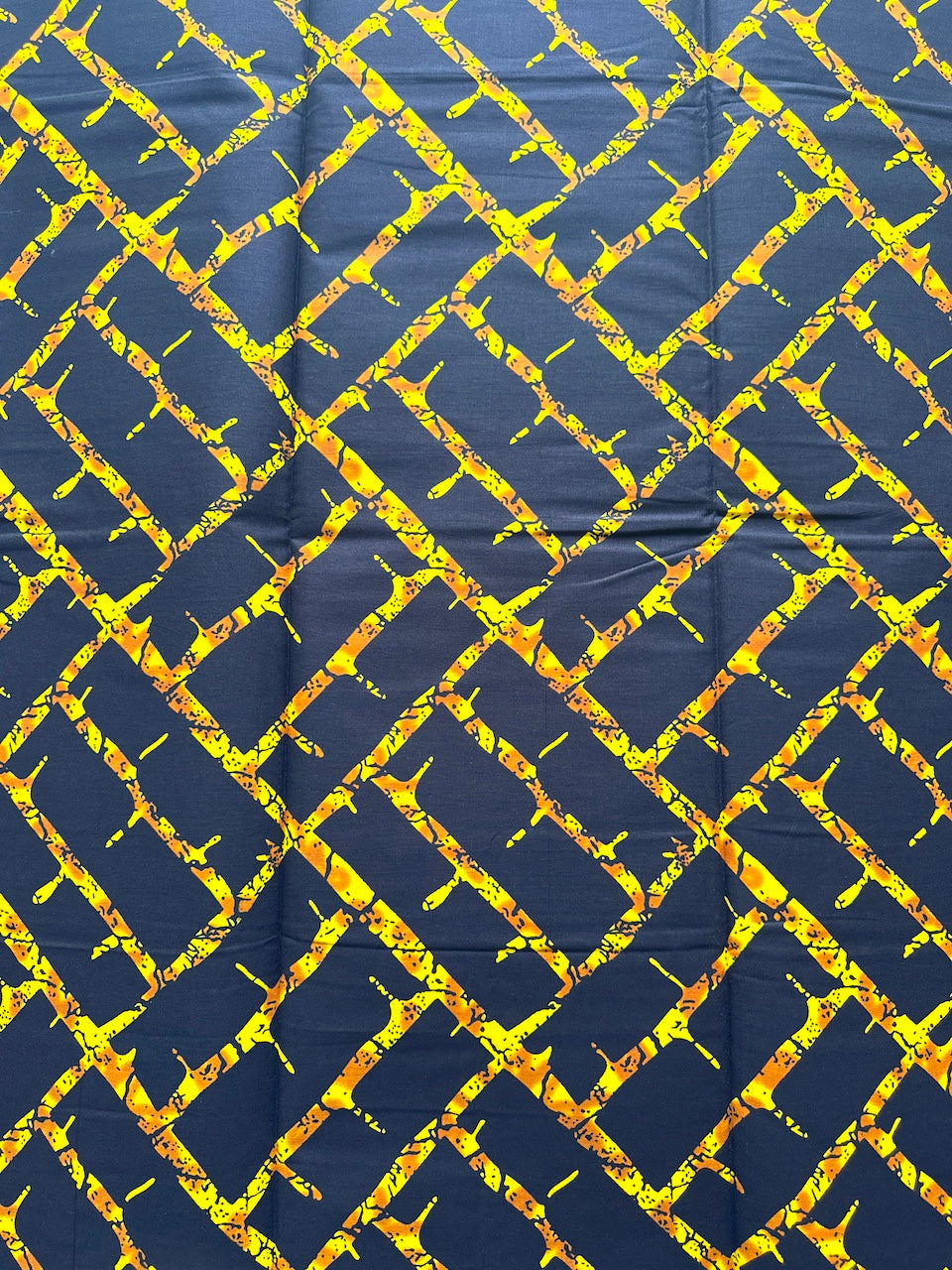 Navy blue fabric with a yellow geometric pattern