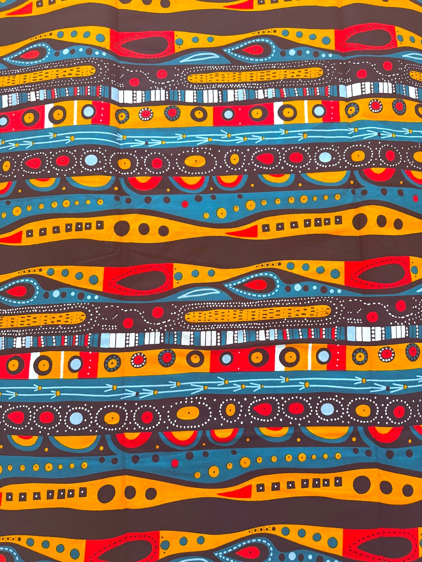 Colorful abstract pattern with wavy lines and circular shapes on a brown background