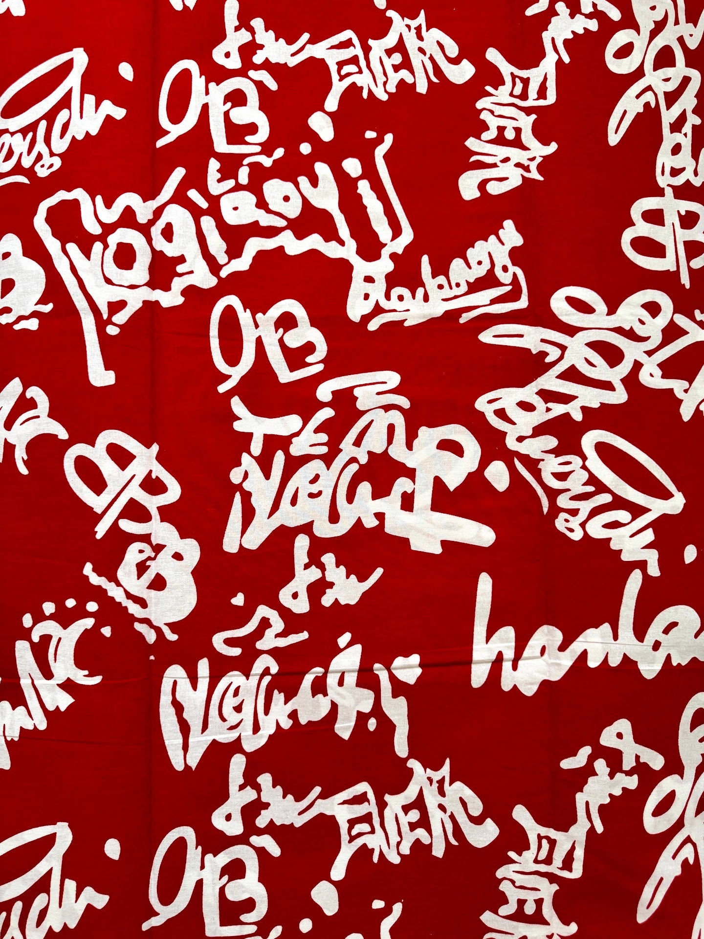 White text pattern on a red background