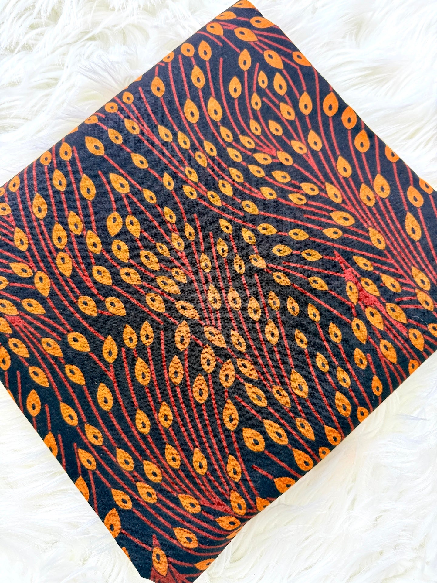 Fabric with peacock feather pattern on a white background