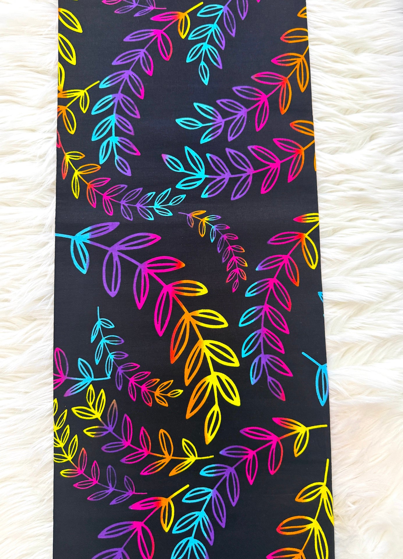Colorful leaf pattern on a black background