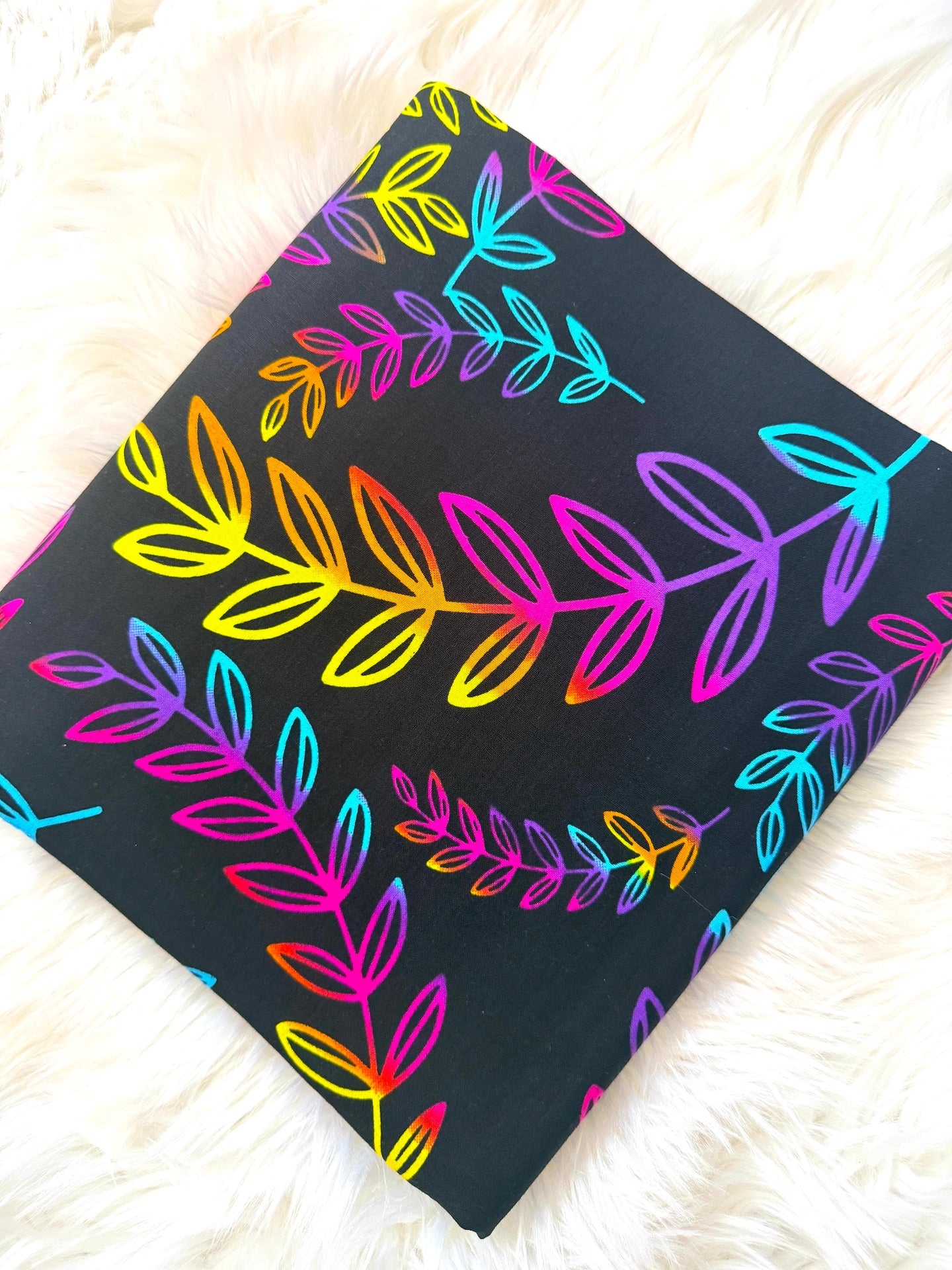 Colorful leaf pattern on a black background