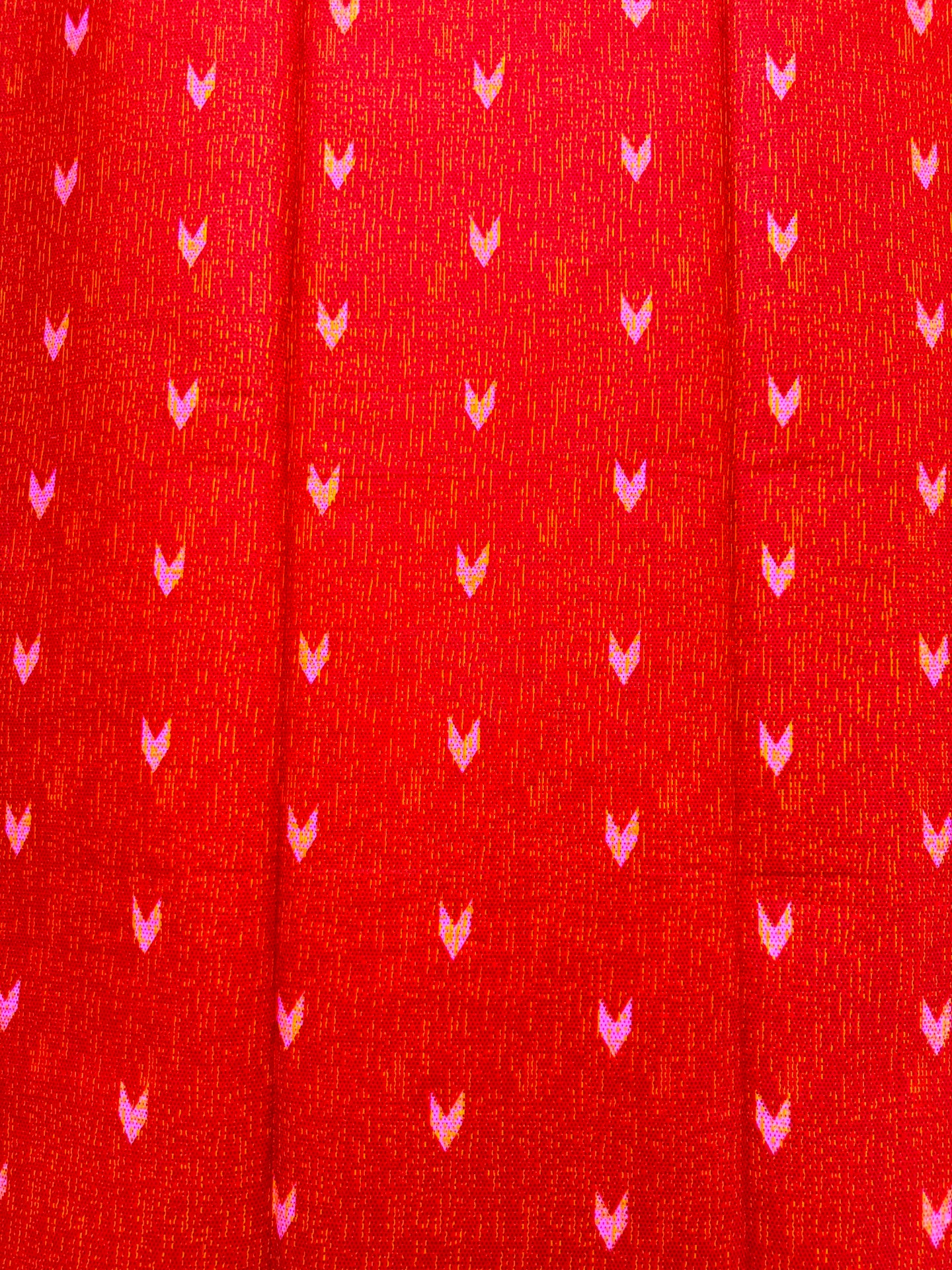 Red fabric with small pink heart patterns