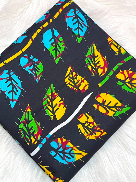 Colorful leaf pattern on a black background with a white knife blade.