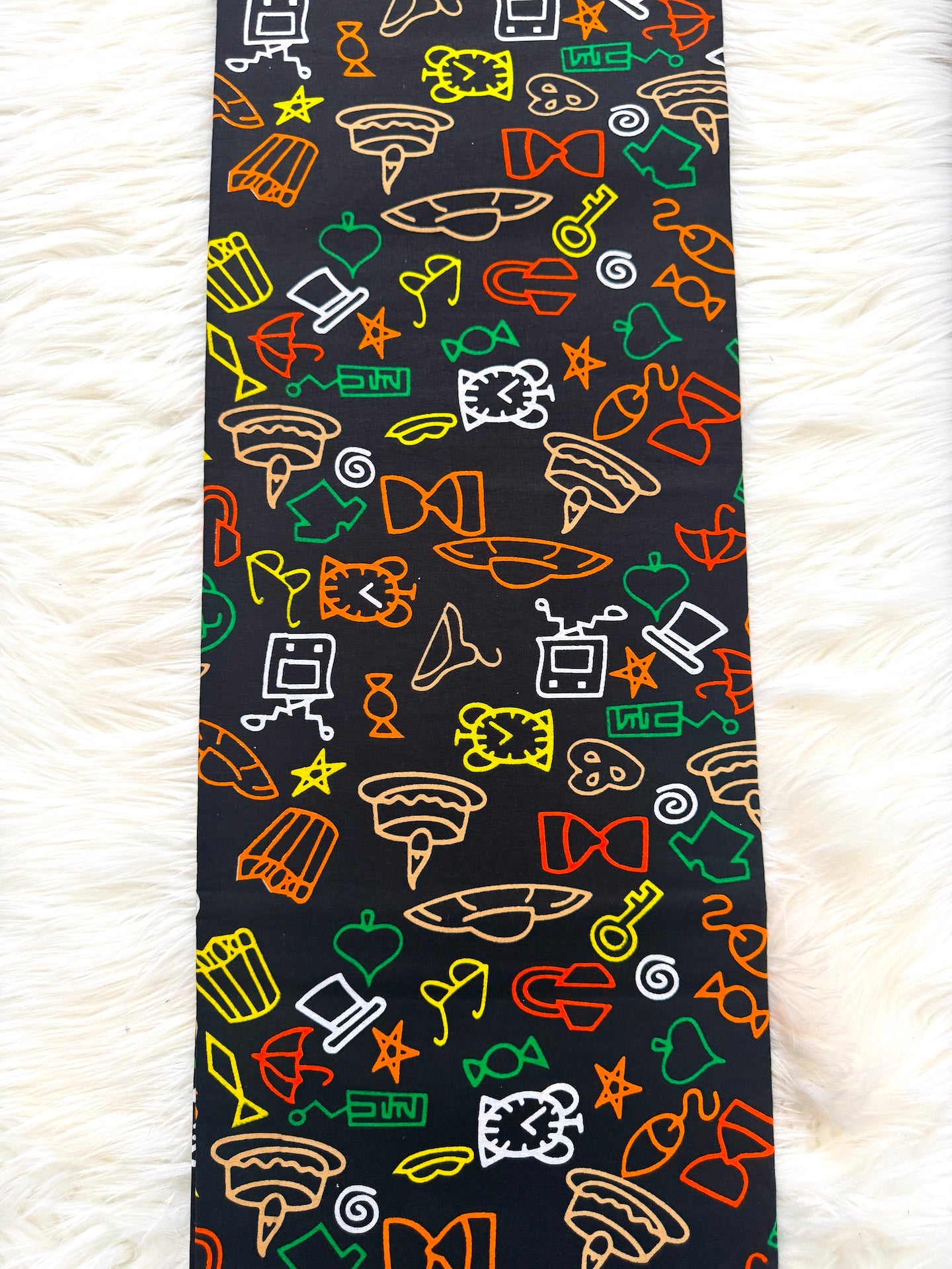 Colorful patterned tie on a white textured background