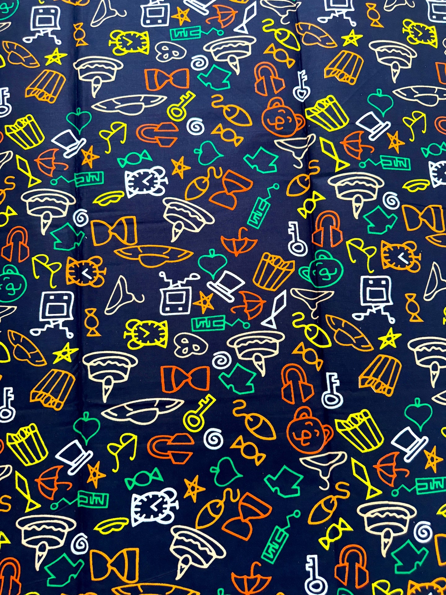 Colorful pattern of various icons on a dark blue background
