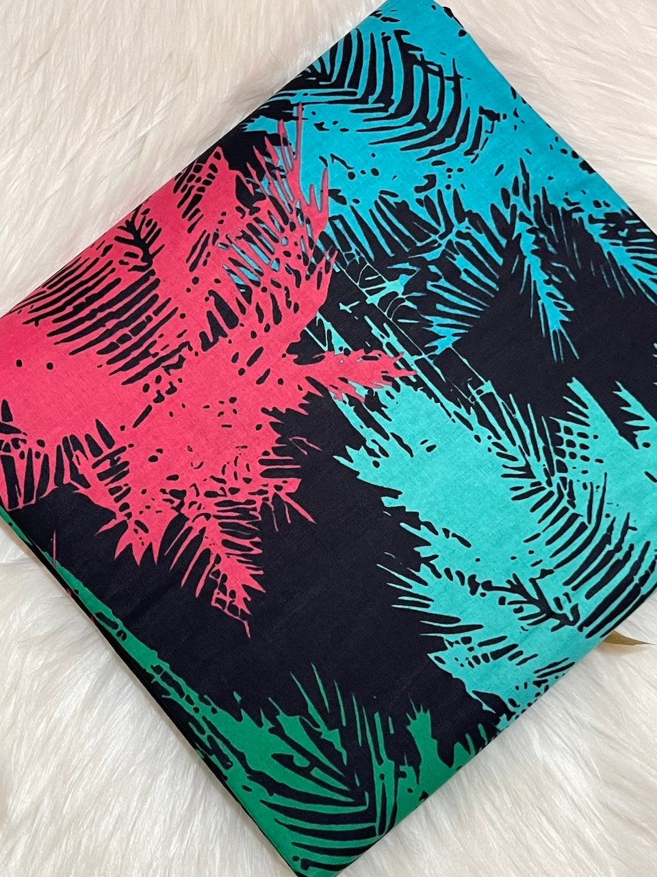 Notebook with colorful abstract design on a light wooden surface