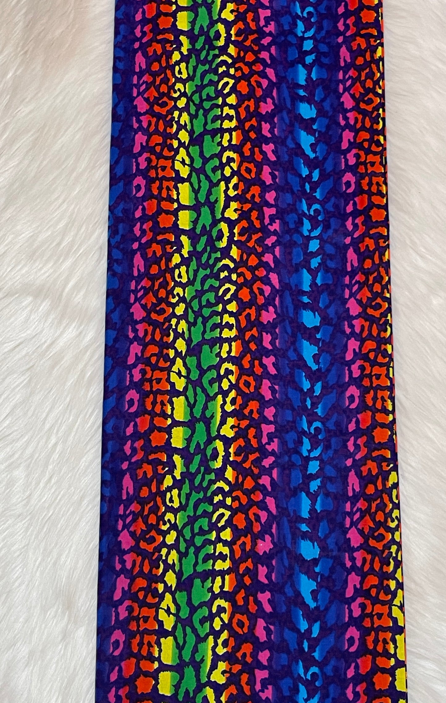 Colorful striped fabric with a pattern on a white background