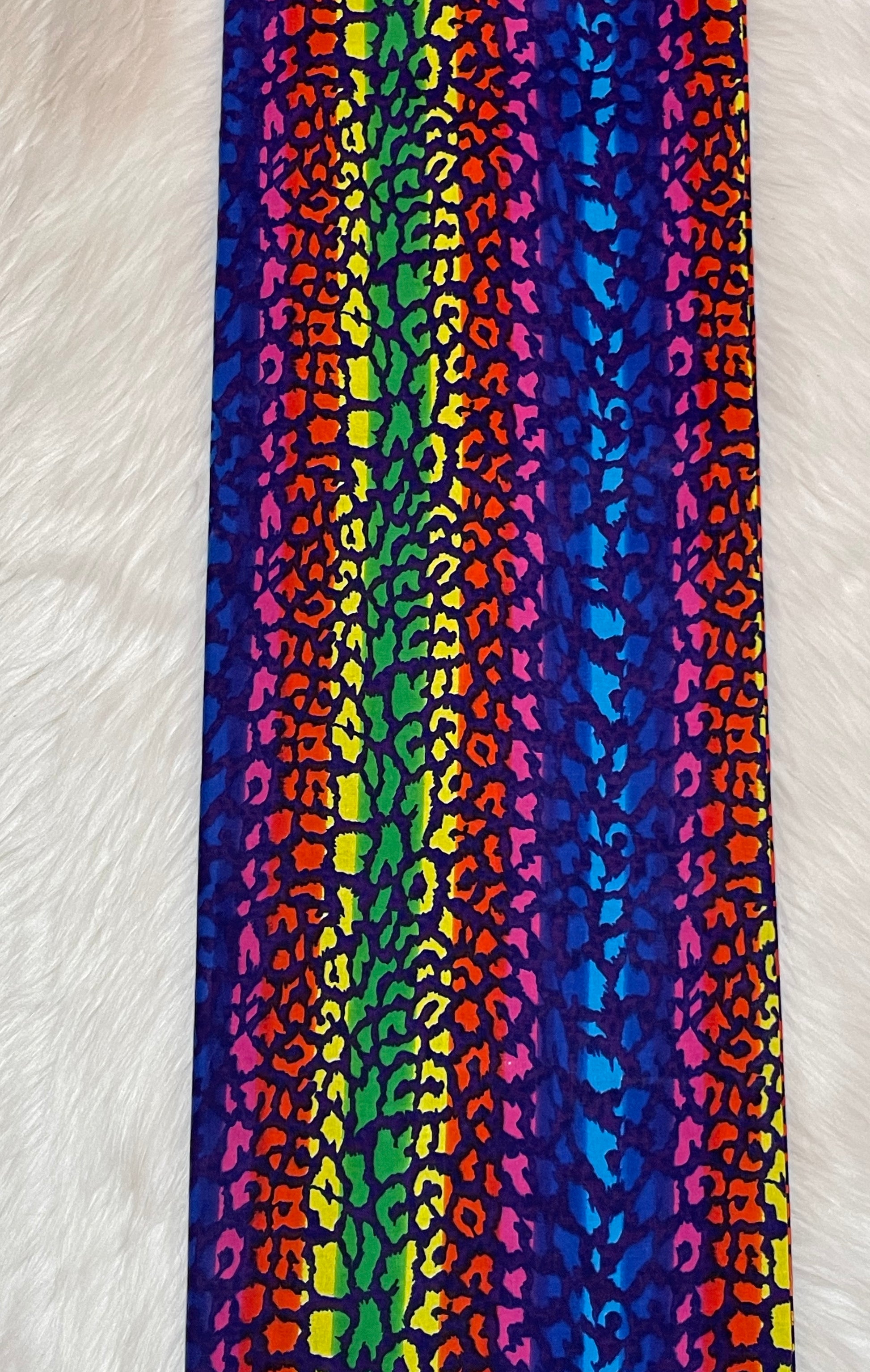 Colorful striped fabric with a pattern on a white background