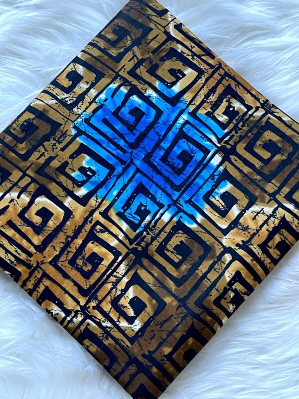 Decorative item with blue and gold geometric pattern on a white background
