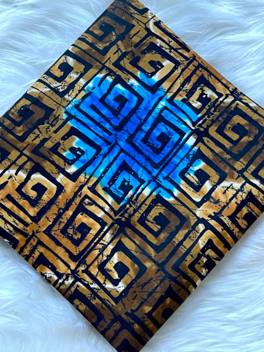 Decorative item with blue and gold geometric pattern on a white background