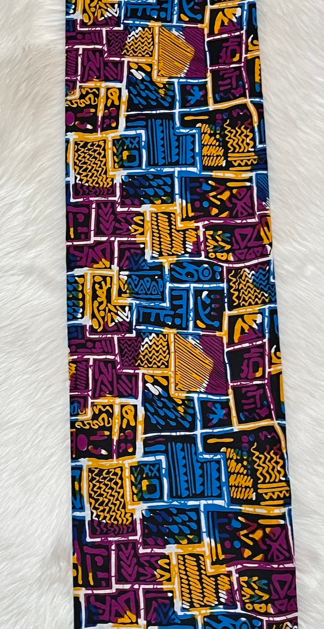 Colorful patterned fabric with geometric design on a white background