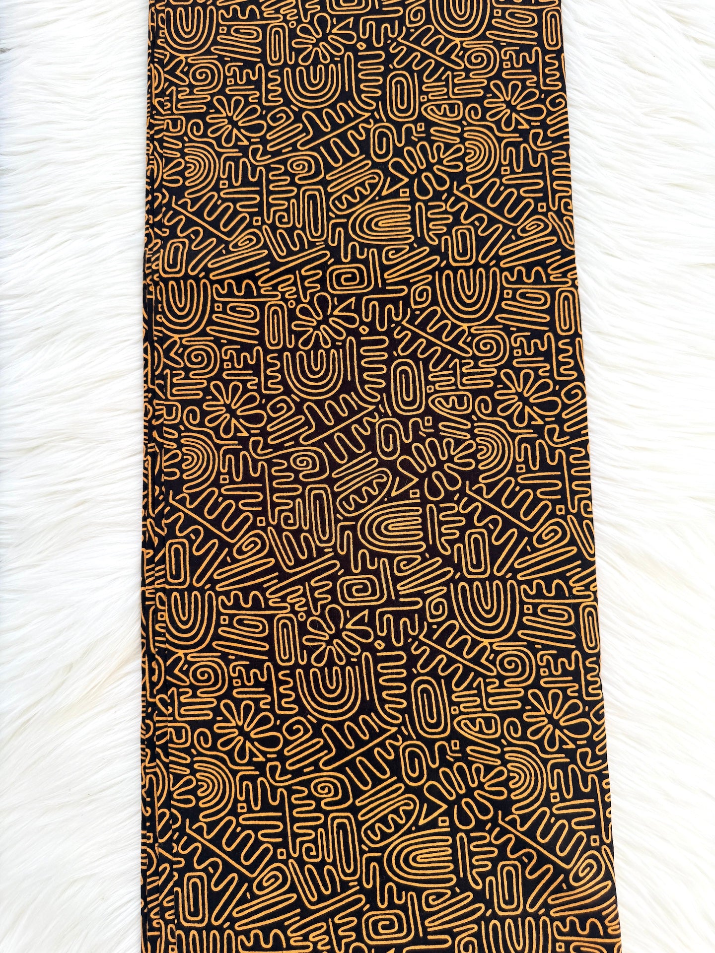Black patterned fabric on a white background