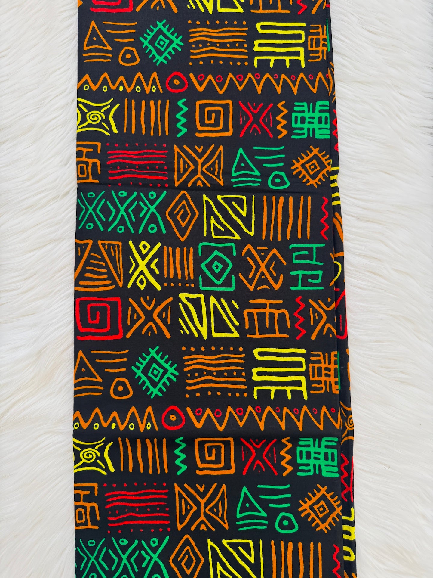 Colorful geometric patterned fabric on a white background