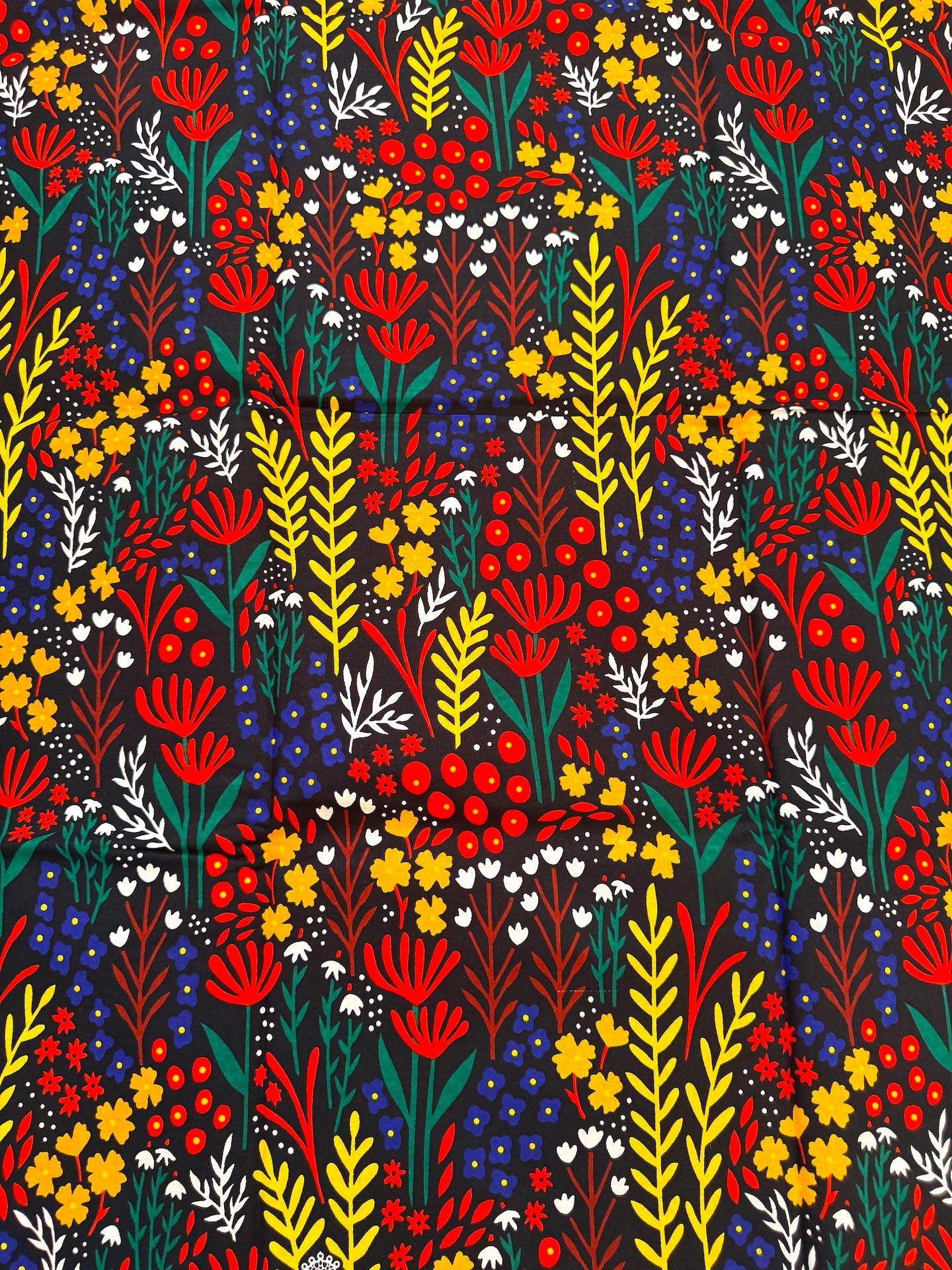 Colorful floral pattern with various flowers on a black background