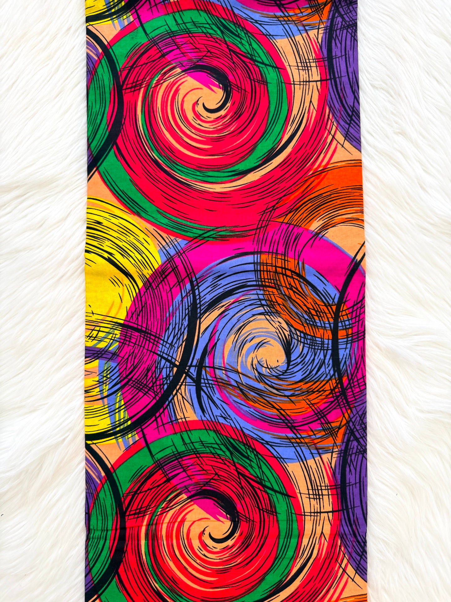 Colorful spiral pattern on a textured white background