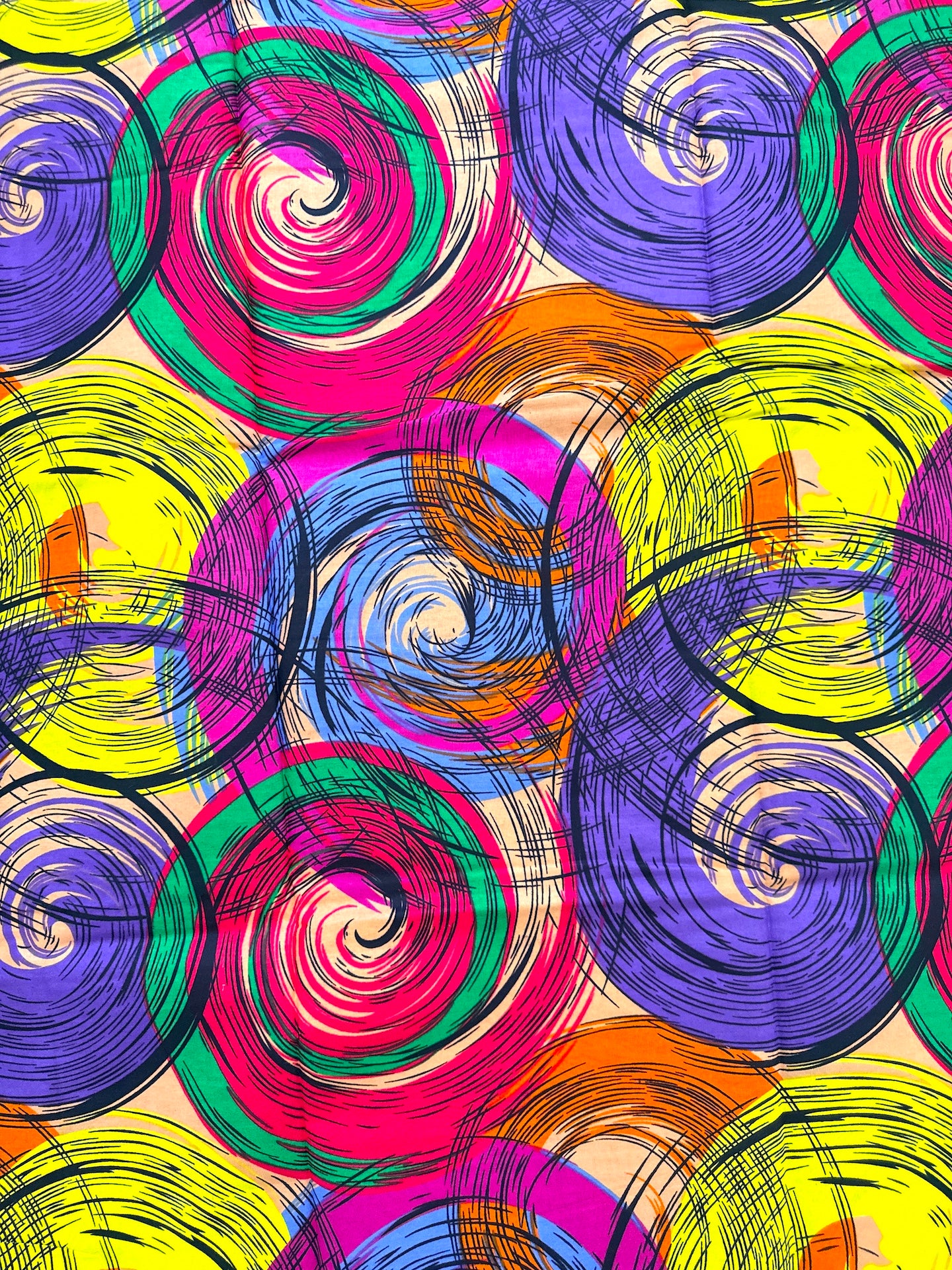 Colorful abstract pattern of swirling circles on a beige background