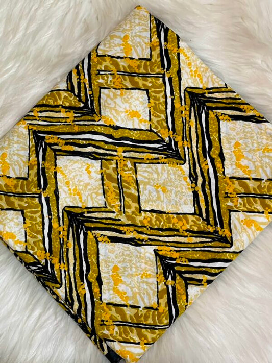 Decorative pillow with geometric pattern on a textured white background