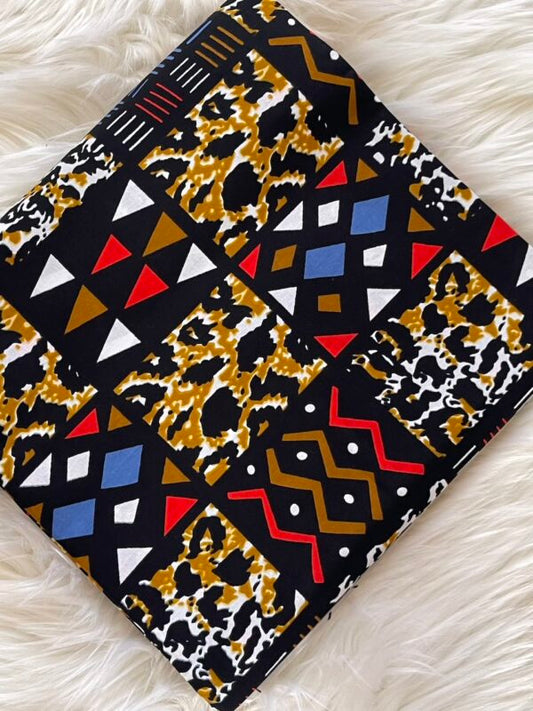 Patterned notebook with geometric and animal print designs on a white surface