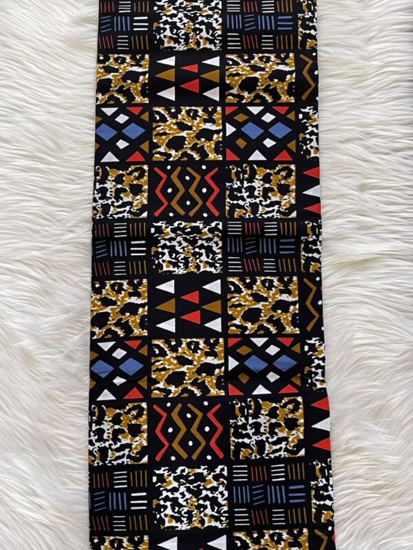 Patterned fabric with geometric design on a white fur background