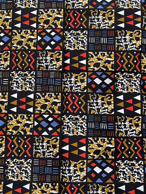 Patterned fabric with geometric design in black, white, red, yellow, and blue.