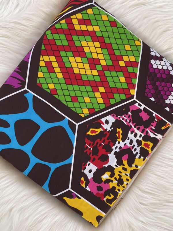 Colorful geometric patterned notebook on a white surface