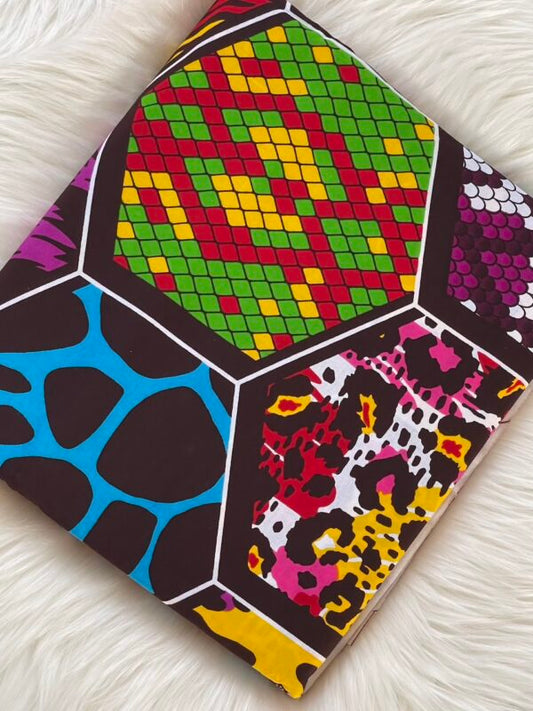 Colorful geometric patterned notebook on a white surface