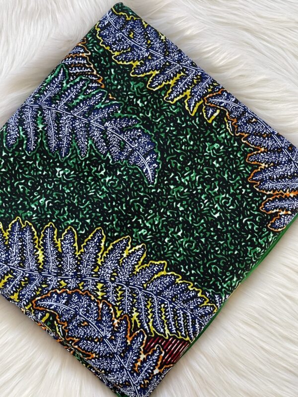 Decorative fabric with leaf pattern on a white surface